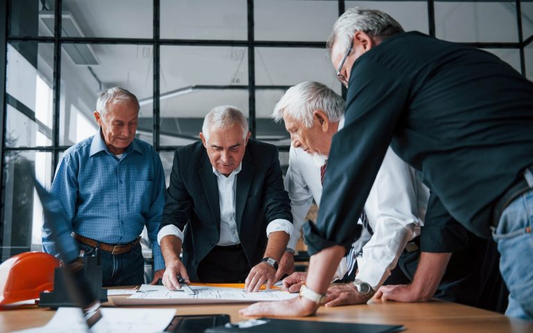 aged-team-of-elderly-businessman-architects-works-2021-08-28-22-30-31-utc